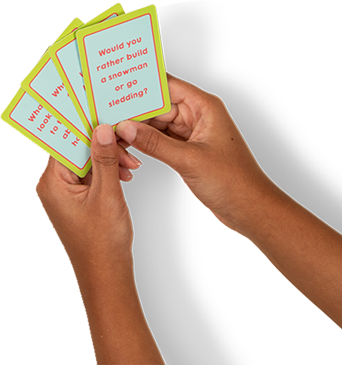 Hand holding Table Talk cards
